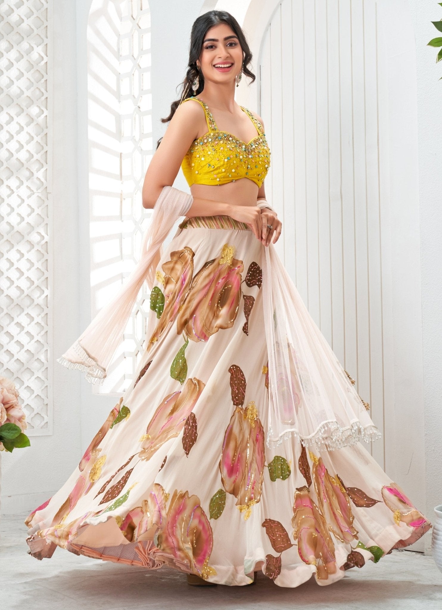Baby pink hand-painted georgette lehenga by Priti Sahni for haldi