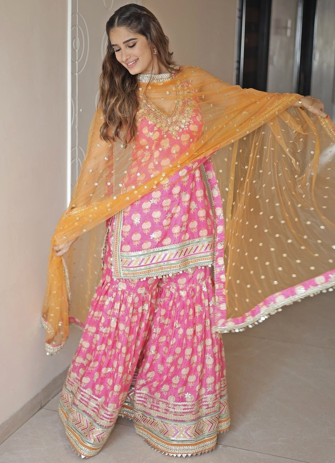 Gopi Vaid Pink Printed Cotton Silk Halter Kurta Sharara Set With Orange DupattaFabilicious Fashion