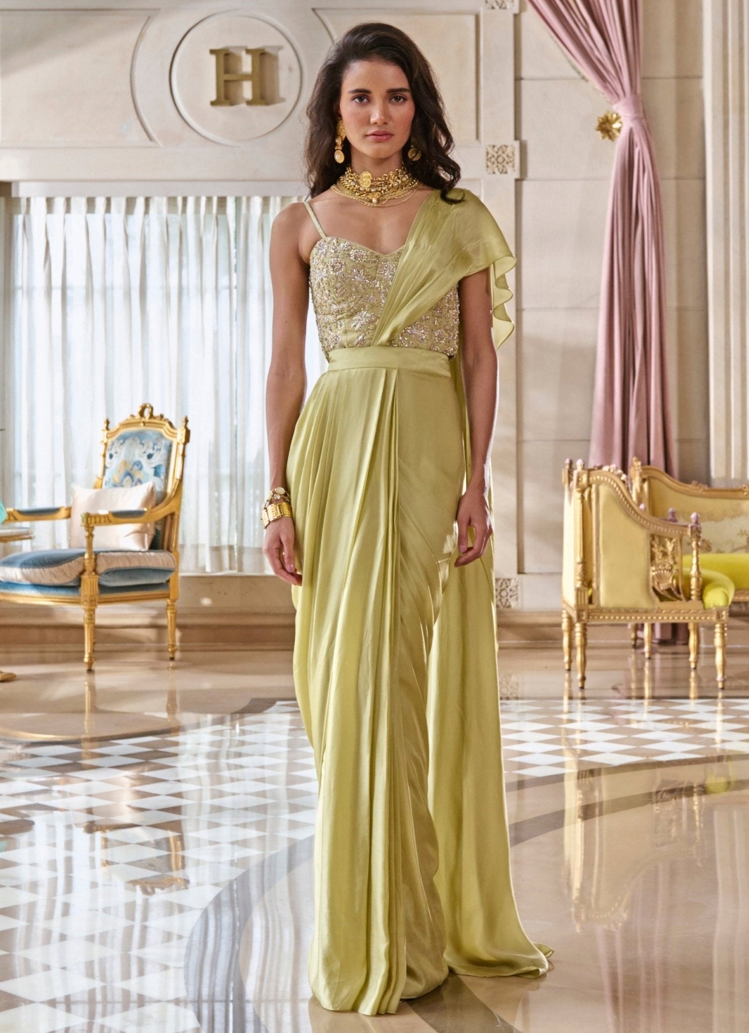 Pista green satin corset saree for festive wedding celebration