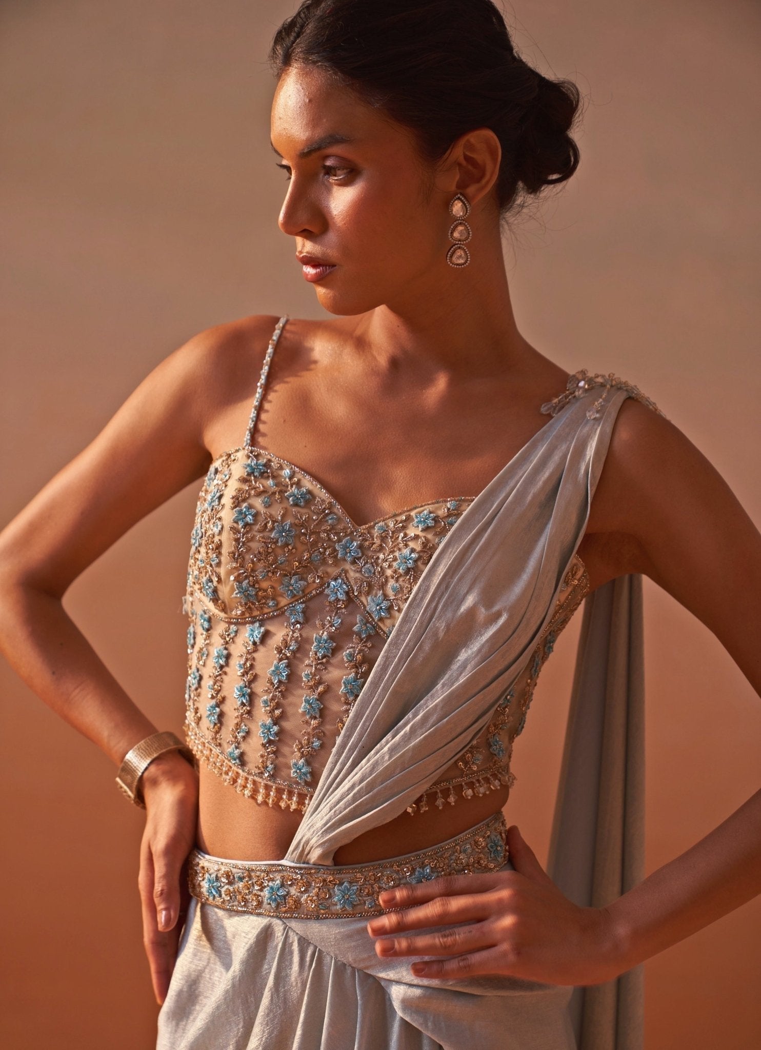 Powder Blue Shimmer Satin Pre-Draped Saree with Corset Blouse by Nitika Gujral for a wedding reception