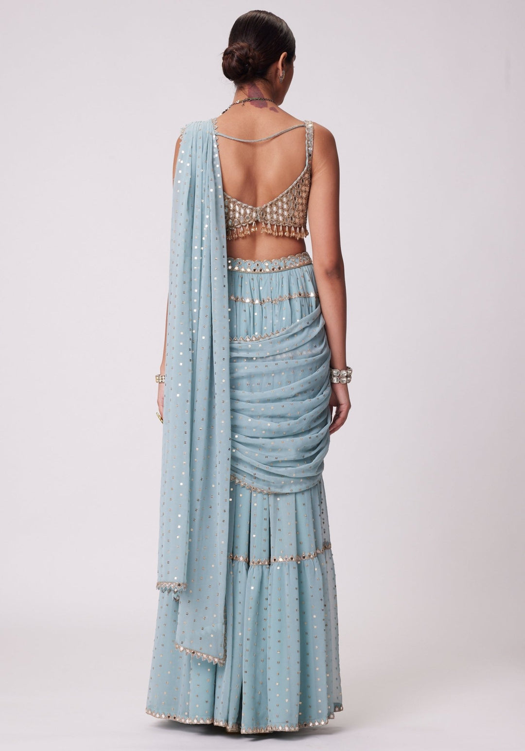 Powder Blue Tiered Saree With Sleeveless Blouse Vvani by Vani Vats - Fabilicious Fashion