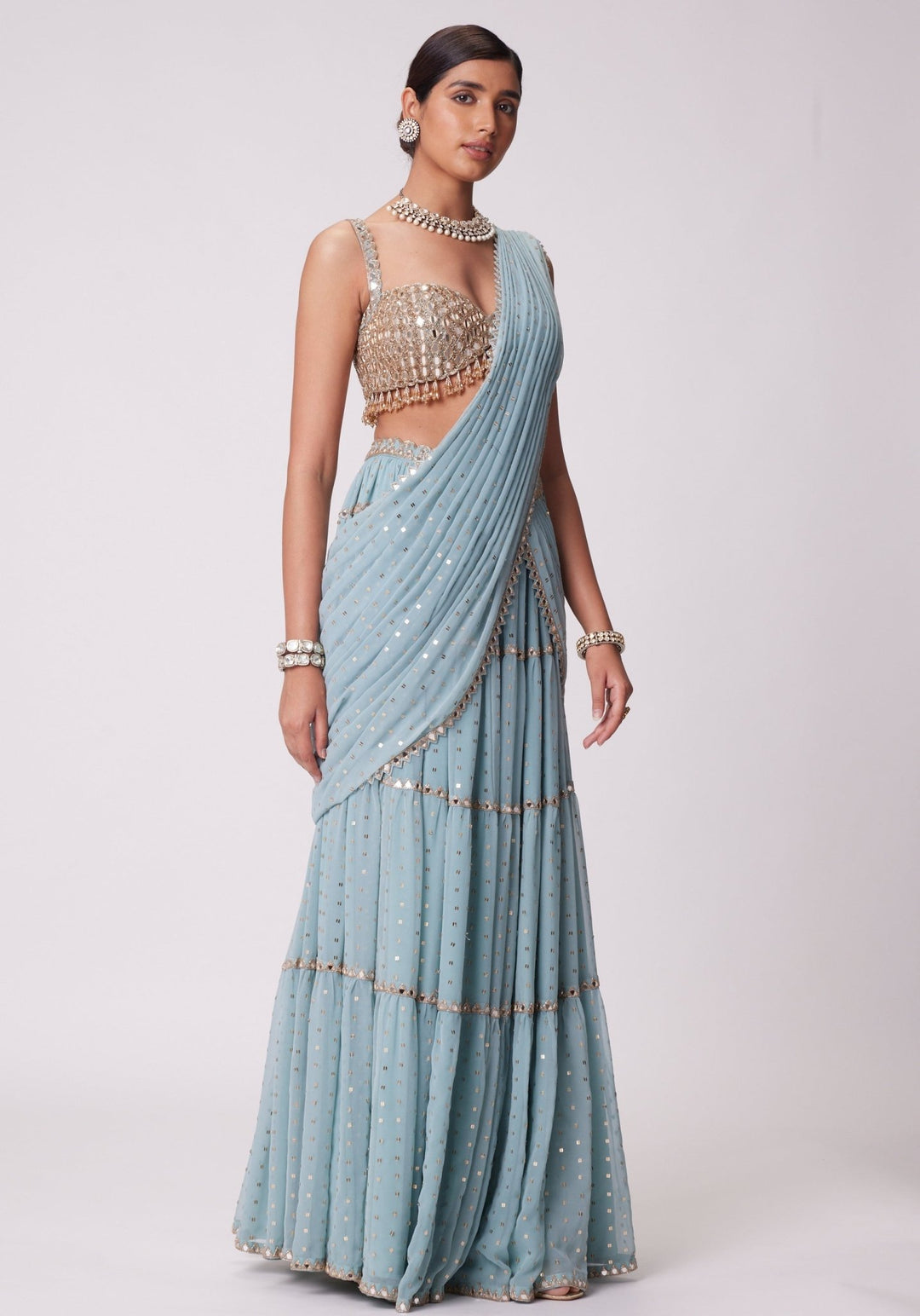 Powder Blue Tiered Saree With Sleeveless Blouse Vvani by Vani Vats - Fabilicious Fashion
