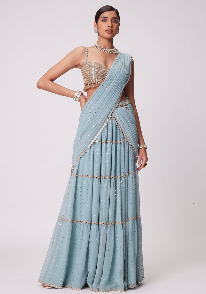 Powder Blue Tiered Saree With Sleeveless Blouse Vvani by Vani Vats - Fabilicious Fashion