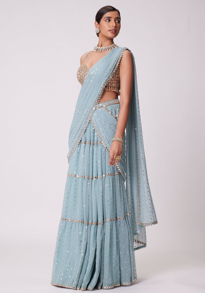 Powder Blue Tiered Saree With Sleeveless Blouse Vvani by Vani Vats - Fabilicious Fashion