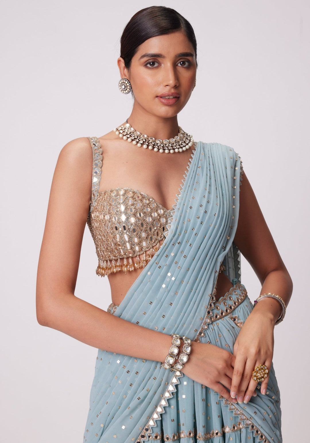 Powder Blue Tiered Saree With Sleeveless Blouse Vvani by Vani Vats - Fabilicious Fashion