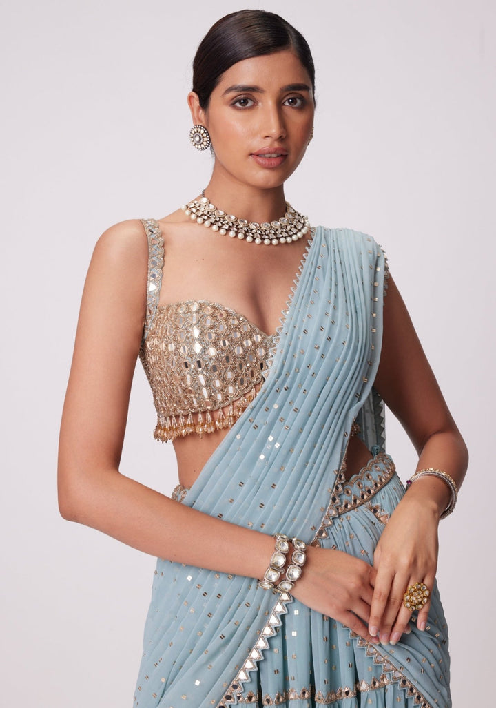 Powder Blue Tiered Saree With Sleeveless Blouse Vvani by Vani Vats - Fabilicious Fashion
