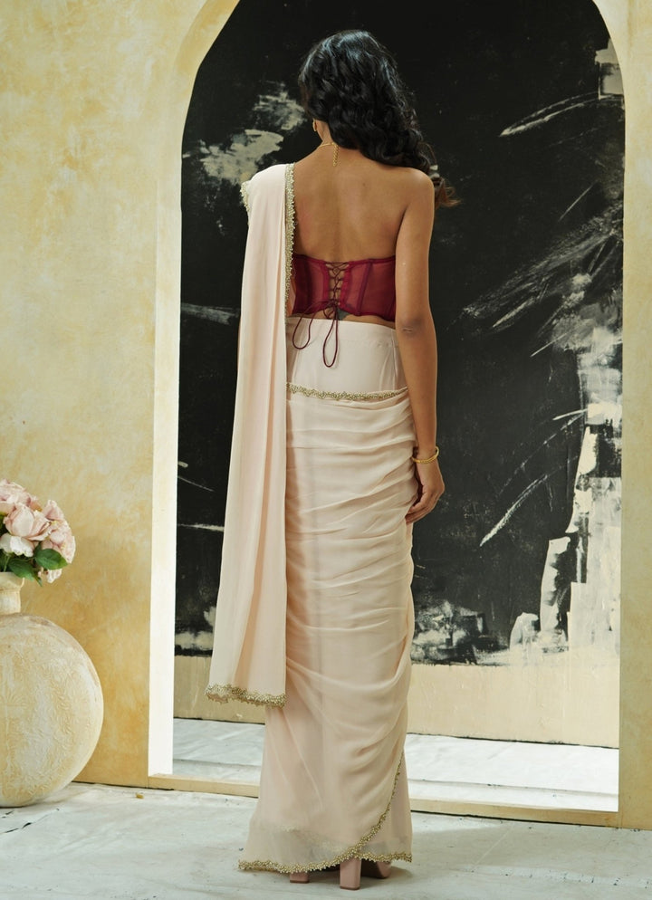 Powder Pink Predraped Georgette Saree Set With Red Corset Priti Sahni - Fabilicious Fashion