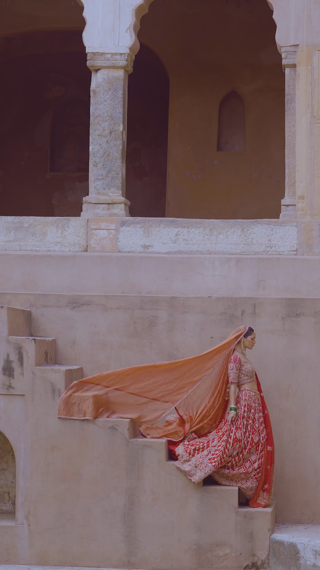 Vibrant Red Tasseled Bridal Lehenga Set With Net Dupatta