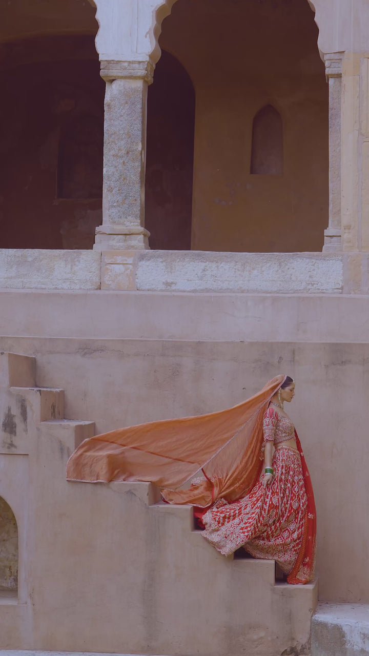 Vibrant Red Tasseled Bridal Lehenga Set With Net Dupatta
