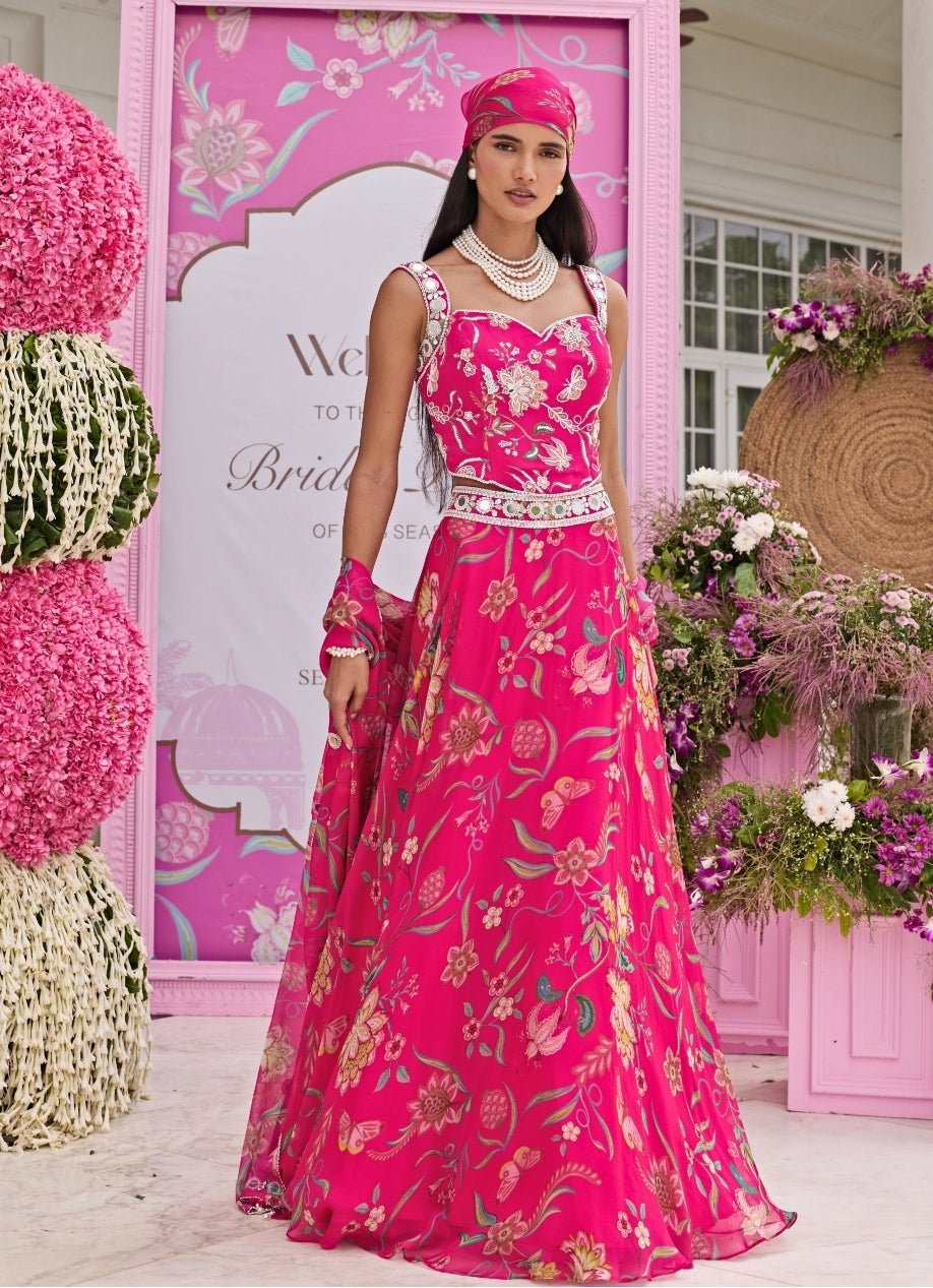 Seema Thukral rani pink printed lehenga with corset blouse — wedding guest cocktail