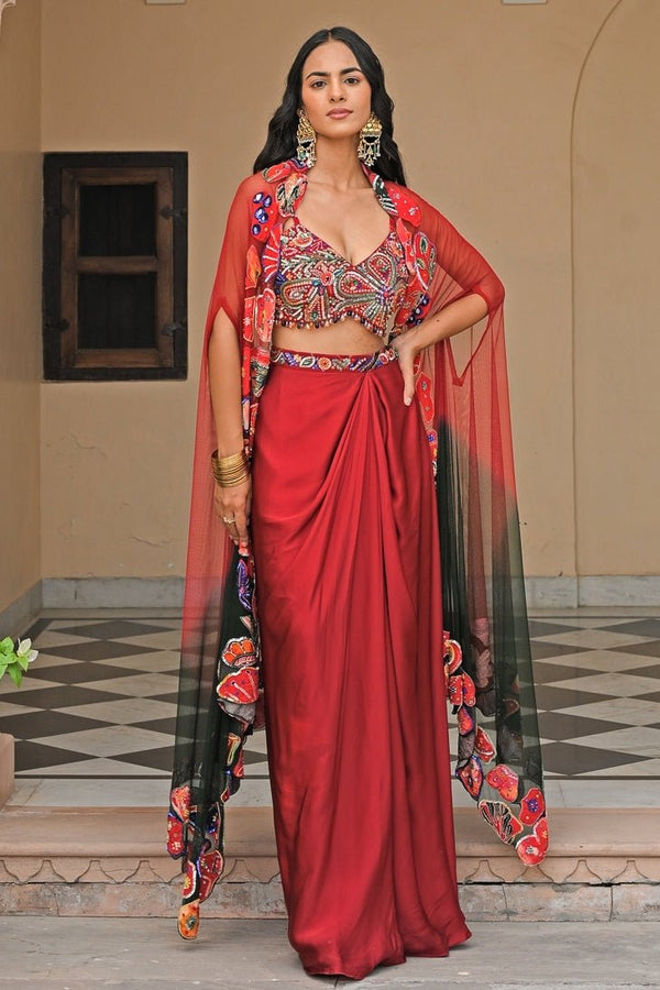 Red and black satin cowl skirt set with appliqué cape by Juhi Bengani