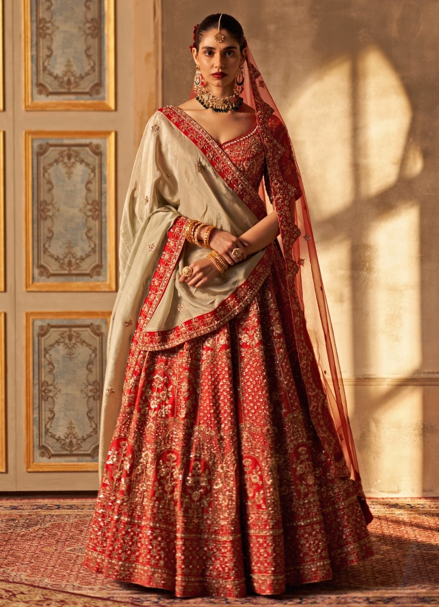 Embroidered regal red raw silk lehenga with double dupatta by Angad Singh