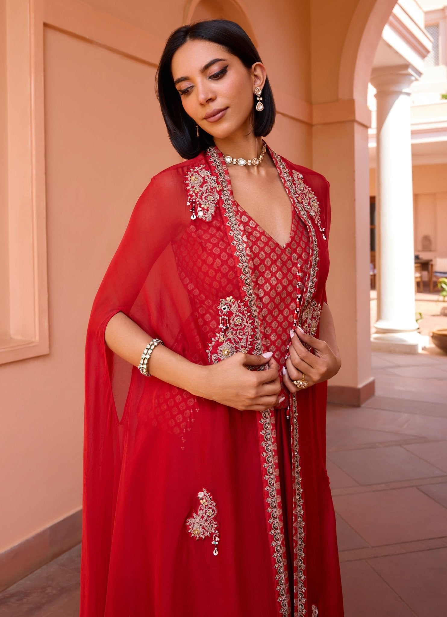 Isha Gupta Tayal red embroidered skirt set with cape — romantic indo western outfit for Valentine’s celebrations