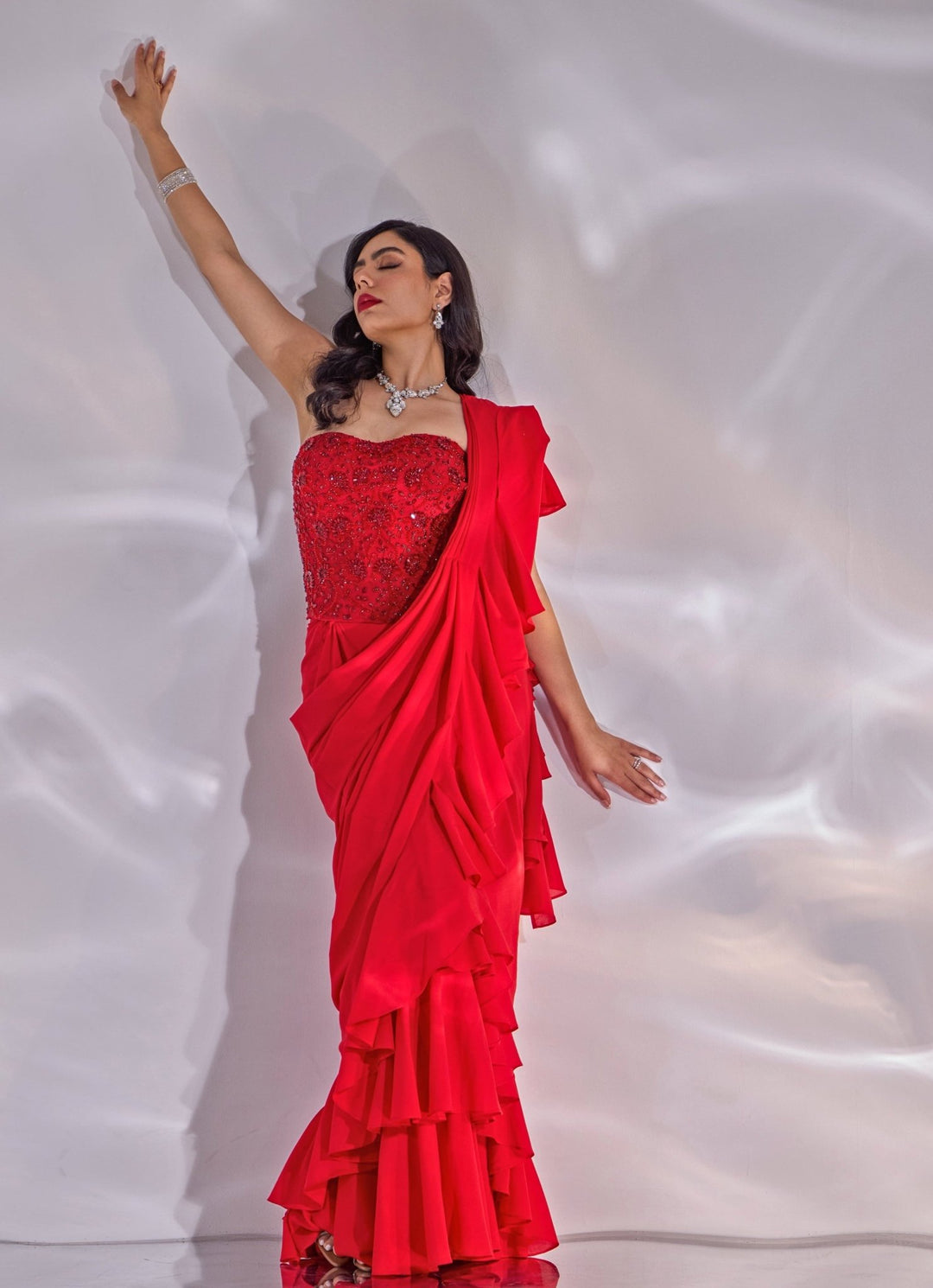 Red Georgette Ruffle Saree With Corset Blouse Rashika Sharma - Fabilicious Fashion