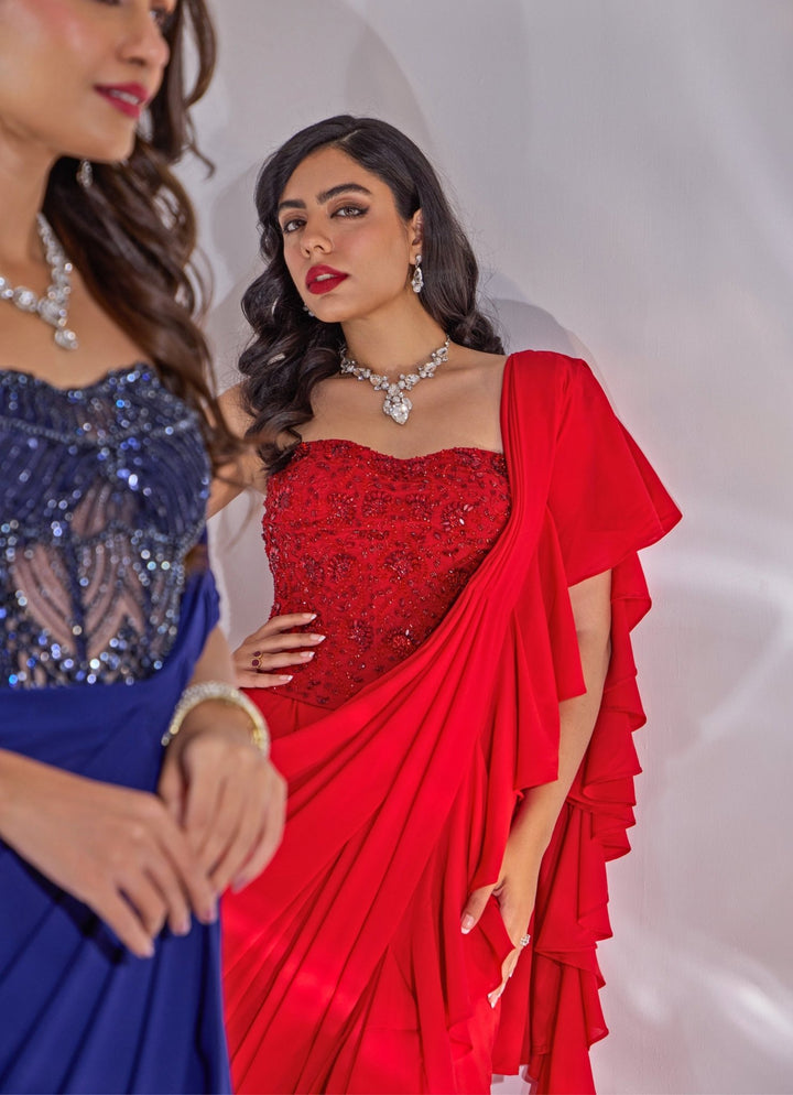 Red Georgette Ruffle Saree With Corset Blouse Rashika Sharma - Fabilicious Fashion
