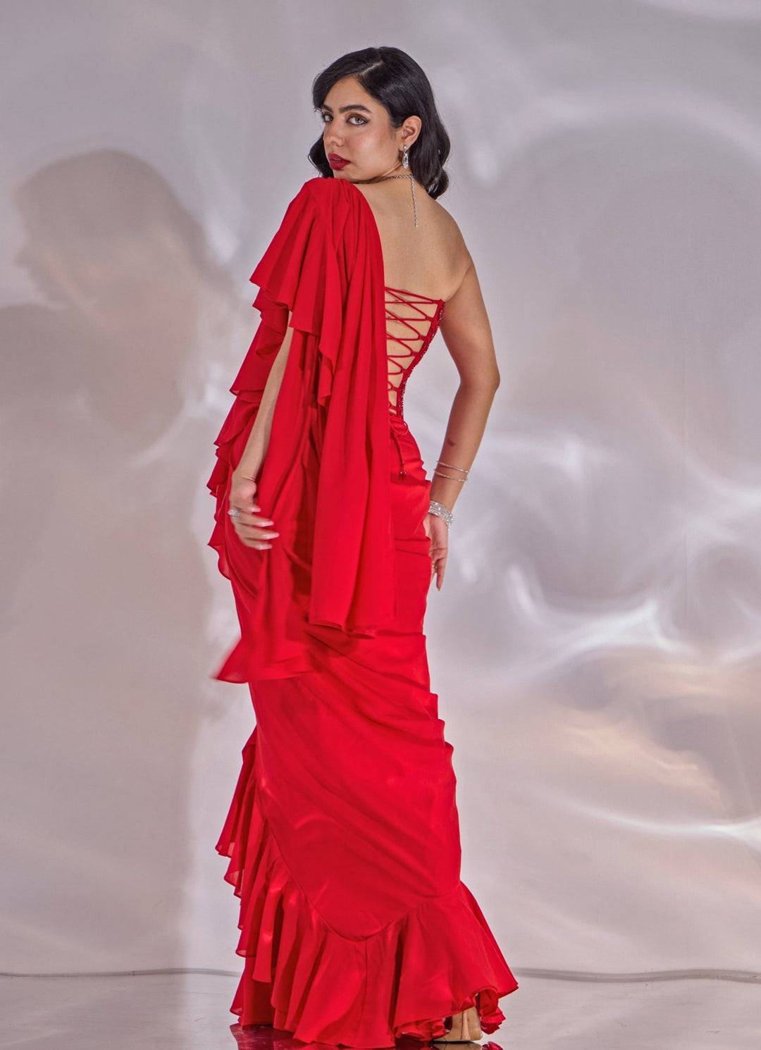 Red Georgette Ruffle Saree With Corset Blouse Rashika Sharma - Fabilicious Fashion