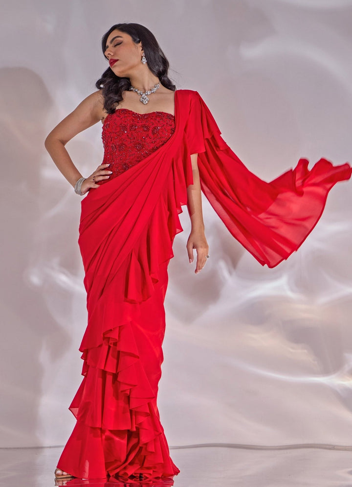 Red Georgette Ruffle Saree With Corset Blouse Rashika Sharma - Fabilicious Fashion