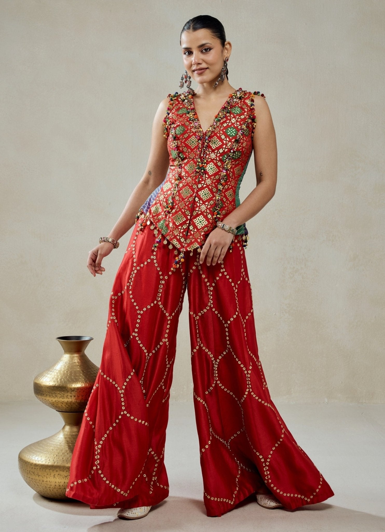 Red Patola silk sharara set by Nitika Gujral for mehendi or jaago wedding guest