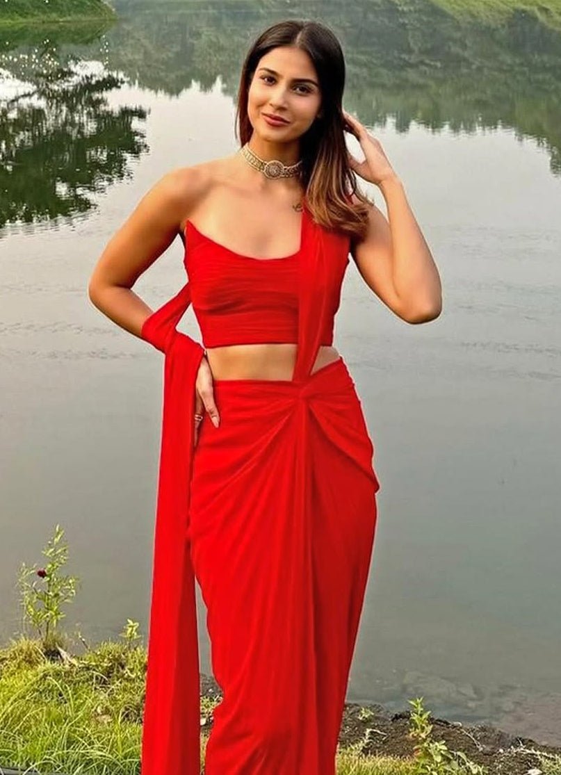 Red pre-draped pure georgette knot saree with corset by Ankita Bajaj Label for cocktail reception