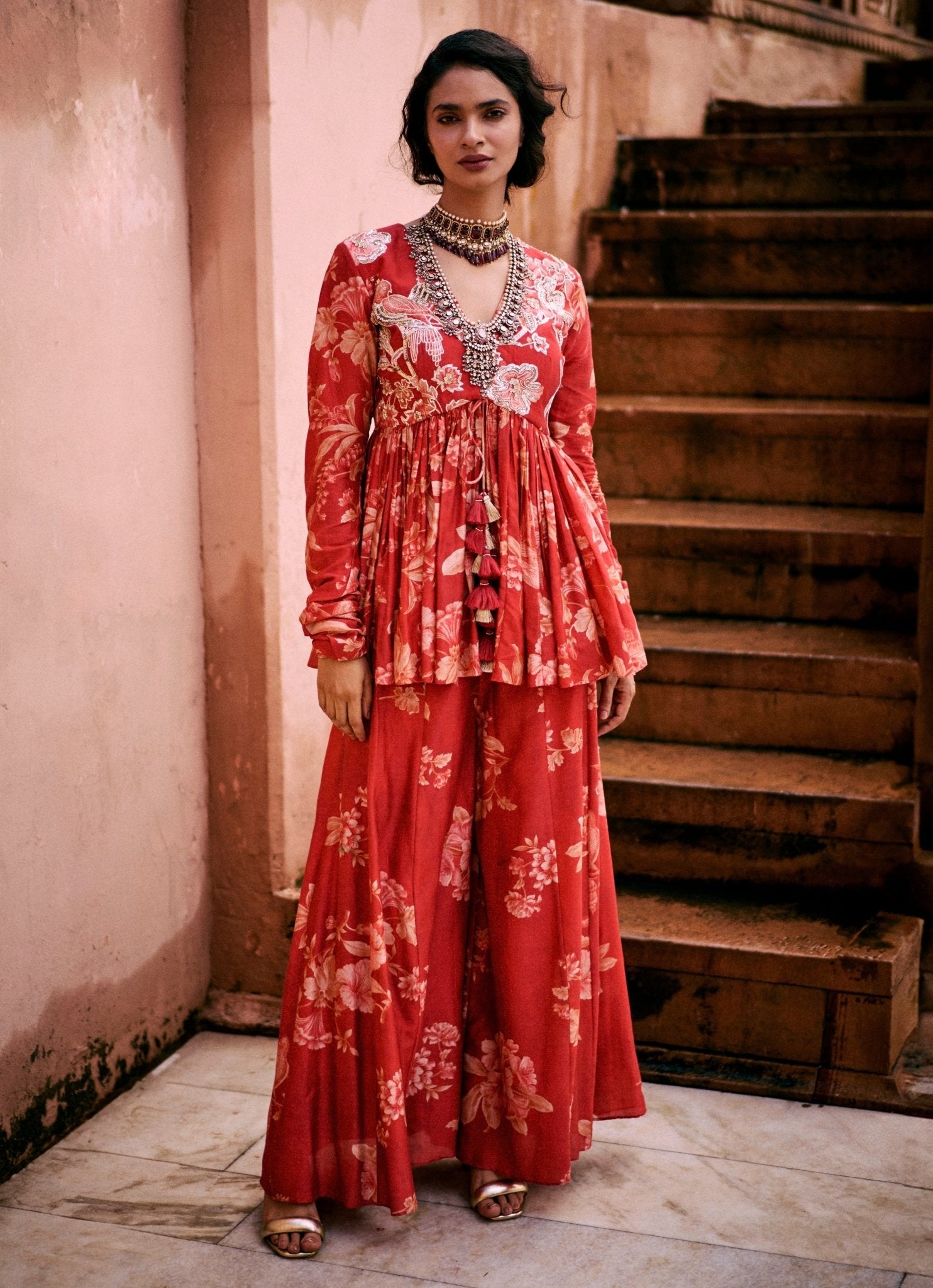 Red printed silk peplum kurta palazzo set by Paulmi and Harsh — festive Rakhi outfit