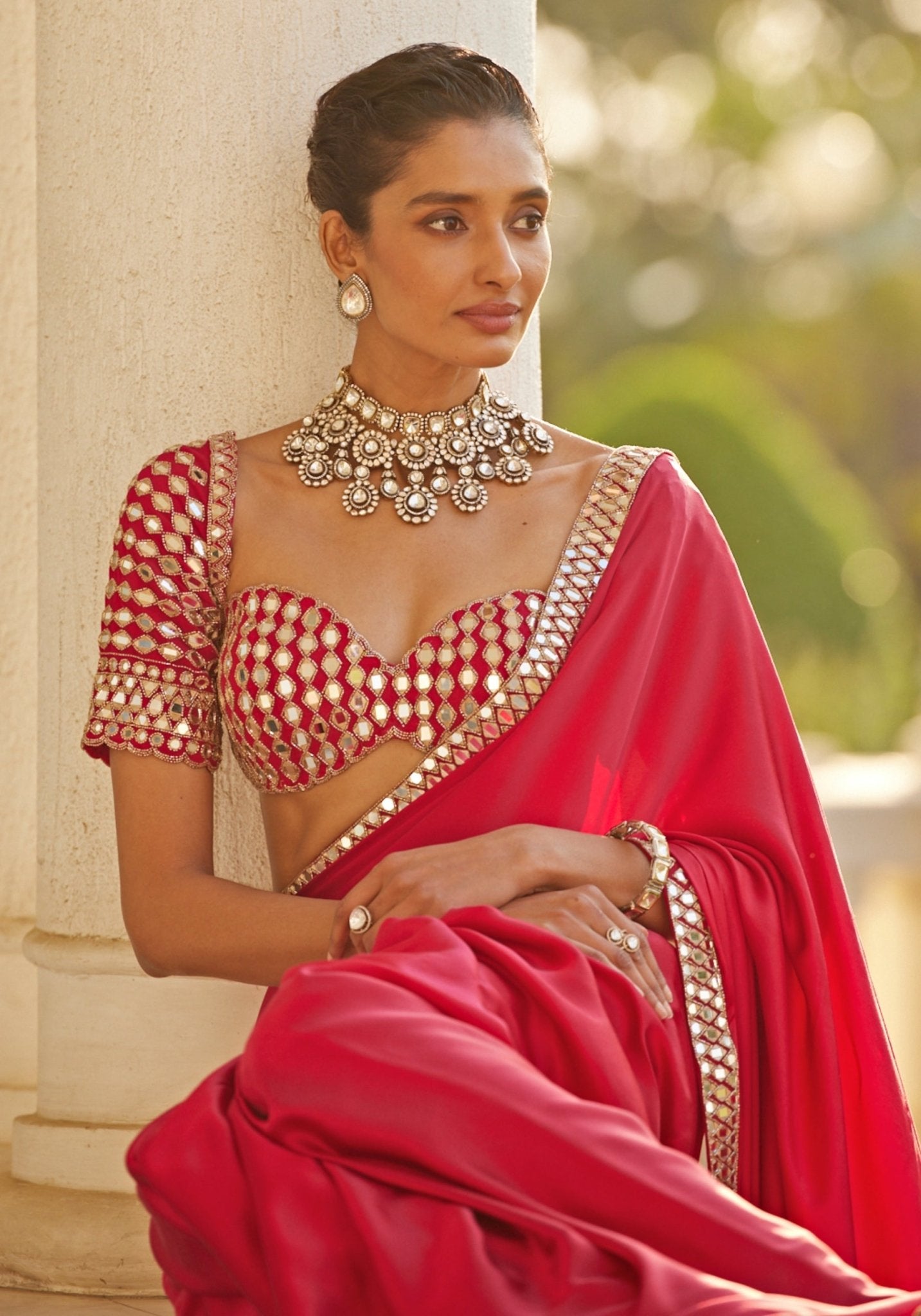 Red satin saree with embroidered mirror blouse by Vvani by Vani Vats