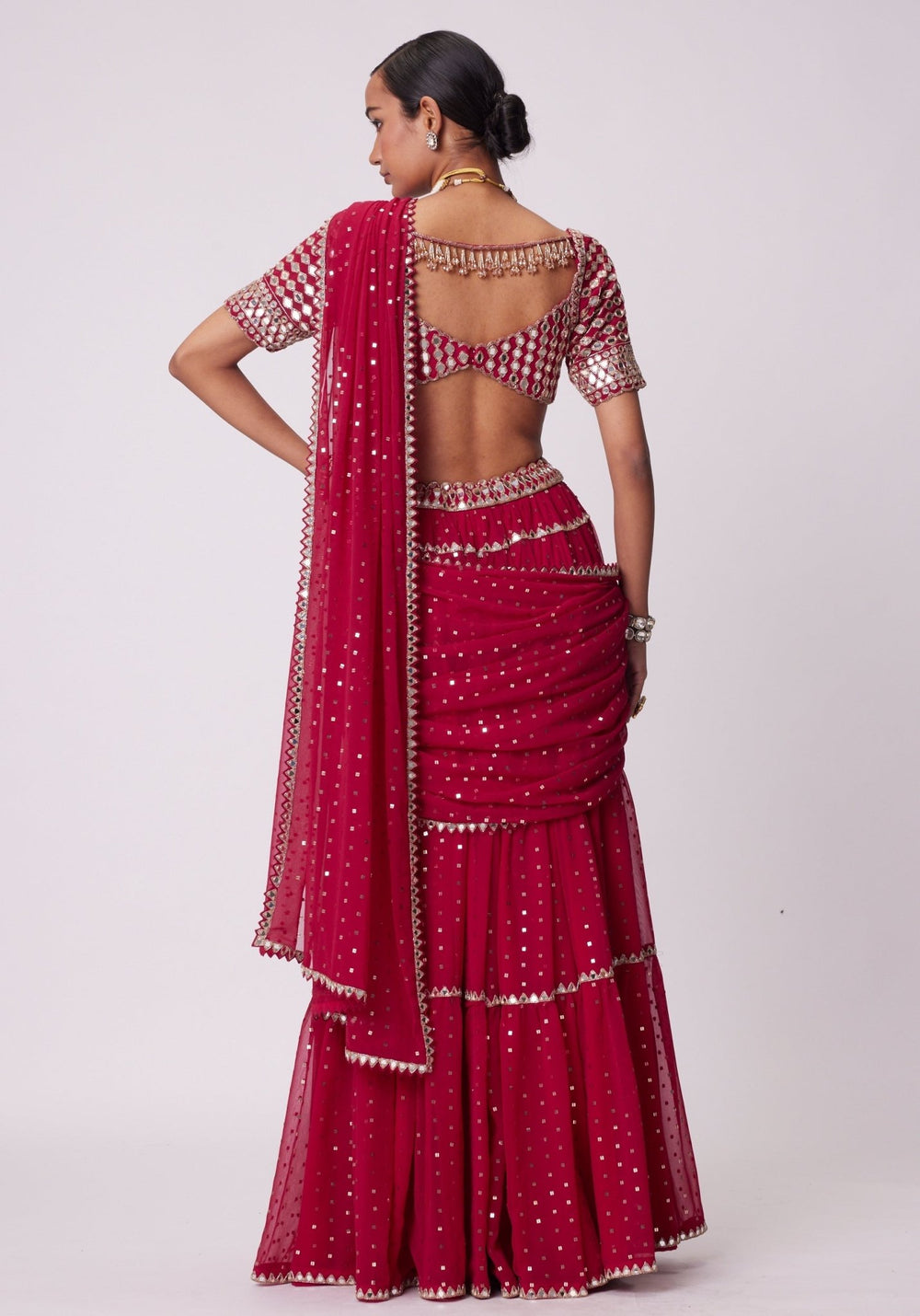 Red Tiered Saree With Elbow Length Sleeves Blouse Vvani by Vani Vats - Fabilicious Fashion
