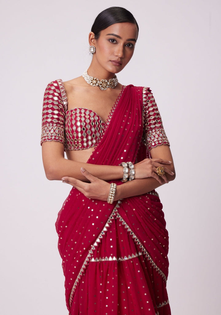 Red Tiered Saree With Elbow Length Sleeves Blouse Vvani by Vani Vats - Fabilicious Fashion