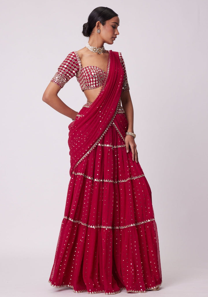 Red Tiered Saree With Elbow Length Sleeves Blouse Vvani by Vani Vats - Fabilicious Fashion