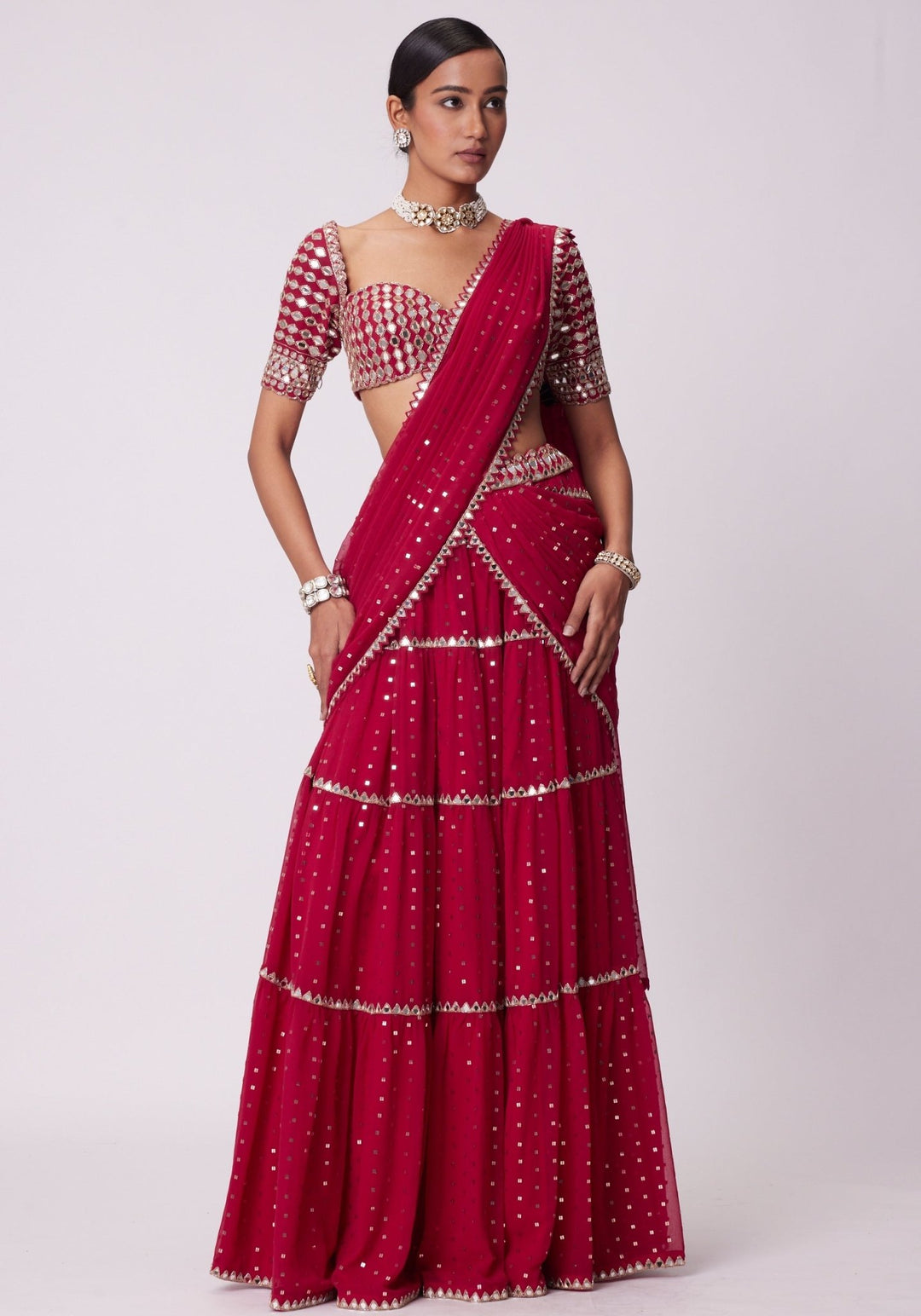 Red Tiered Saree With Elbow Length Sleeves Blouse Vvani by Vani Vats - Fabilicious Fashion