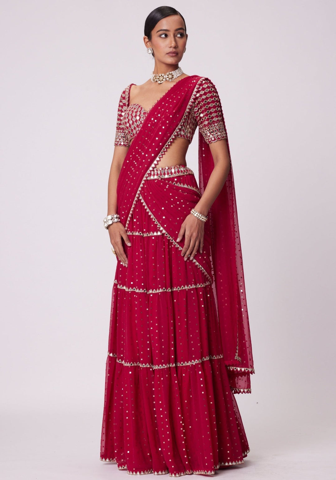 Red Tiered Saree With Elbow Length Sleeves Blouse Vvani by Vani Vats - Fabilicious Fashion