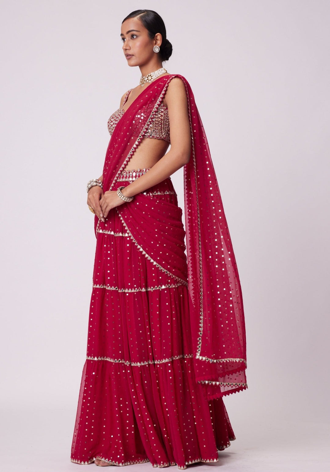 Red Tiered Saree With Sleeveless Blouse Vvani by Vani Vats - Fabilicious Fashion