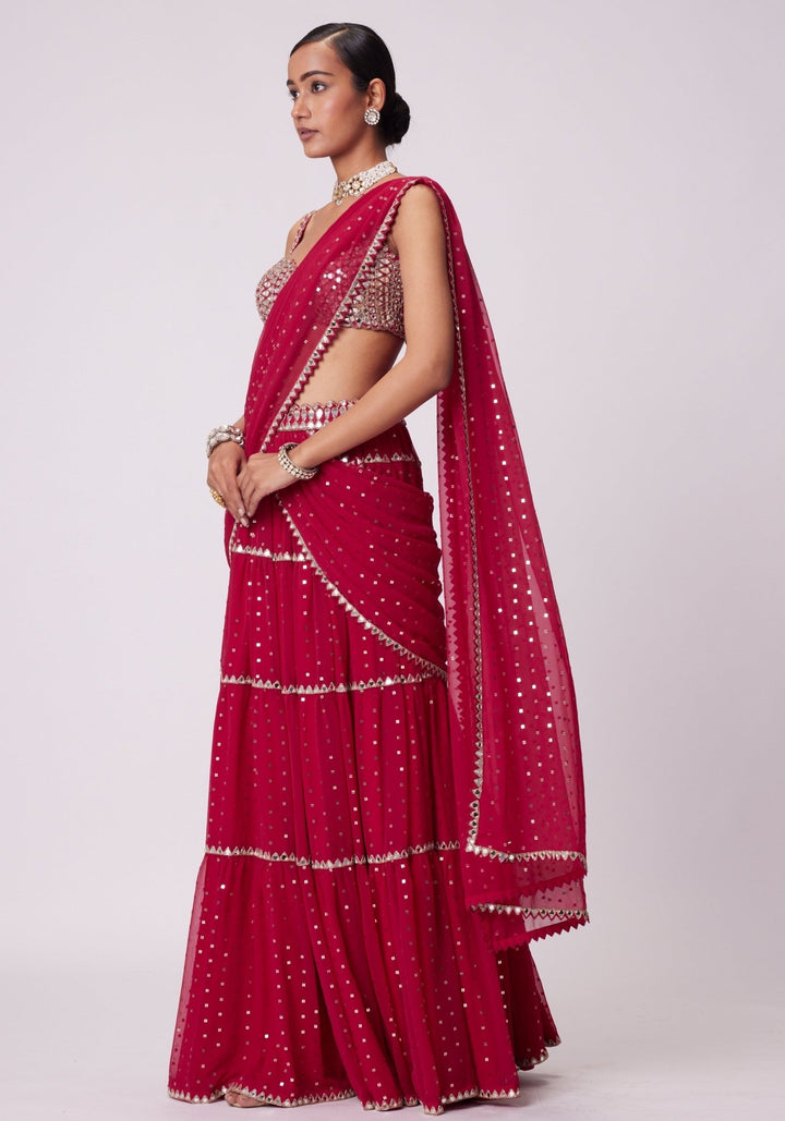 Red Tiered Saree With Sleeveless Blouse Vvani by Vani Vats - Fabilicious Fashion