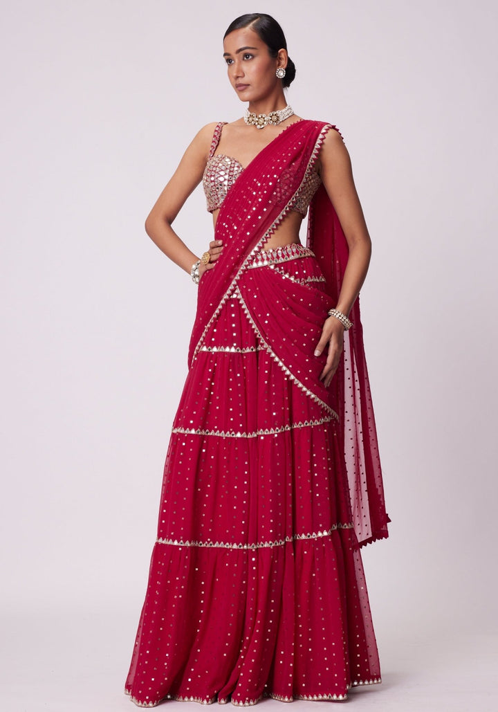 Red Tiered Saree With Sleeveless Blouse Vvani by Vani Vats - Fabilicious Fashion