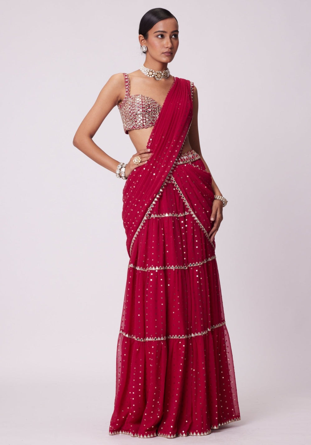 Red Tiered Saree With Sleeveless Blouse Vvani by Vani Vats - Fabilicious Fashion