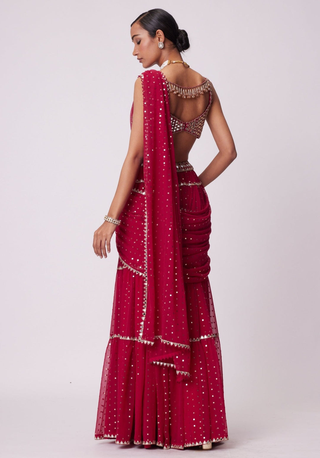 Red Tiered Saree With Sleeveless Blouse Vvani by Vani Vats - Fabilicious Fashion