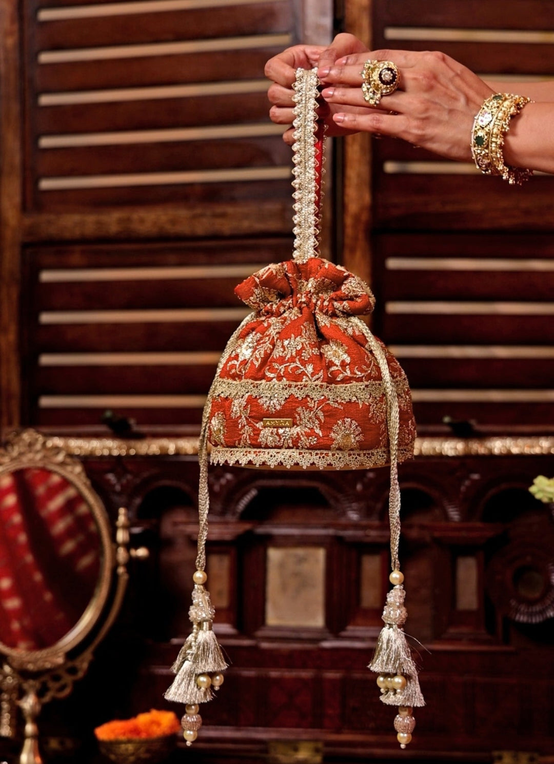 Amyra Rust Orange Embroidered Base PotliFabilicious Fashion