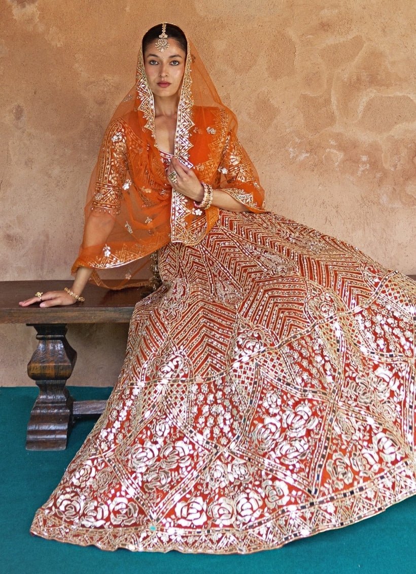 Angad Singh Rust Orange Organza Lehenga SetFabilicious Fashion