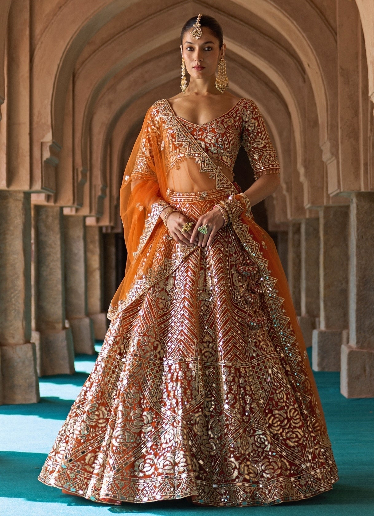 Rust orange organza Angad Singh bridal lehenga