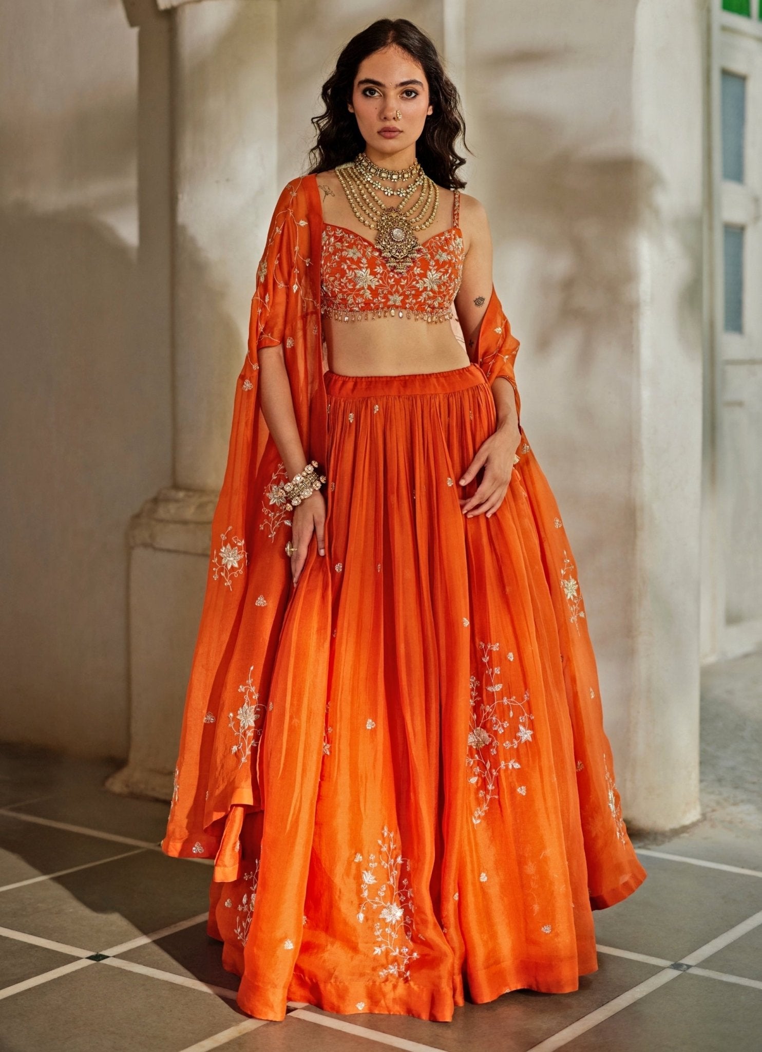 Rust orange organza lehenga for mehendi London by Paulmi and Harsh