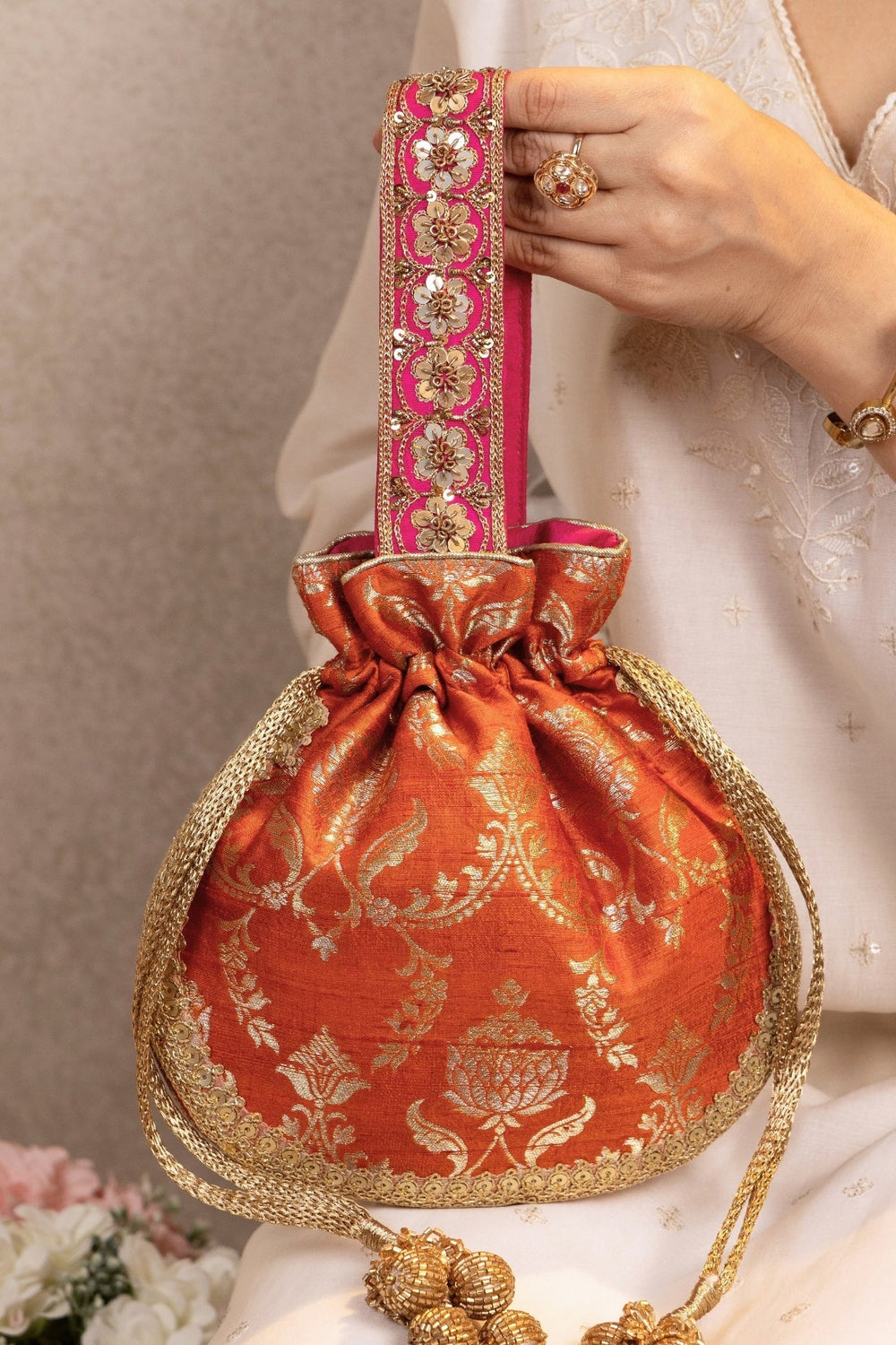 Amyra Rust Orange Raw Silk Embroidered PotliFabilicious Fashion