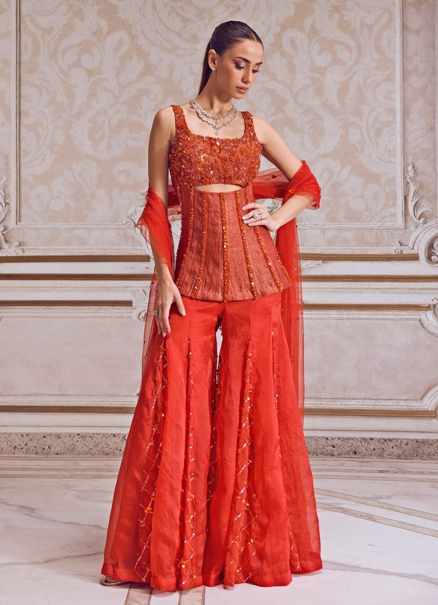 Rust orange tissue sharara with corset by Sanya Gulati
