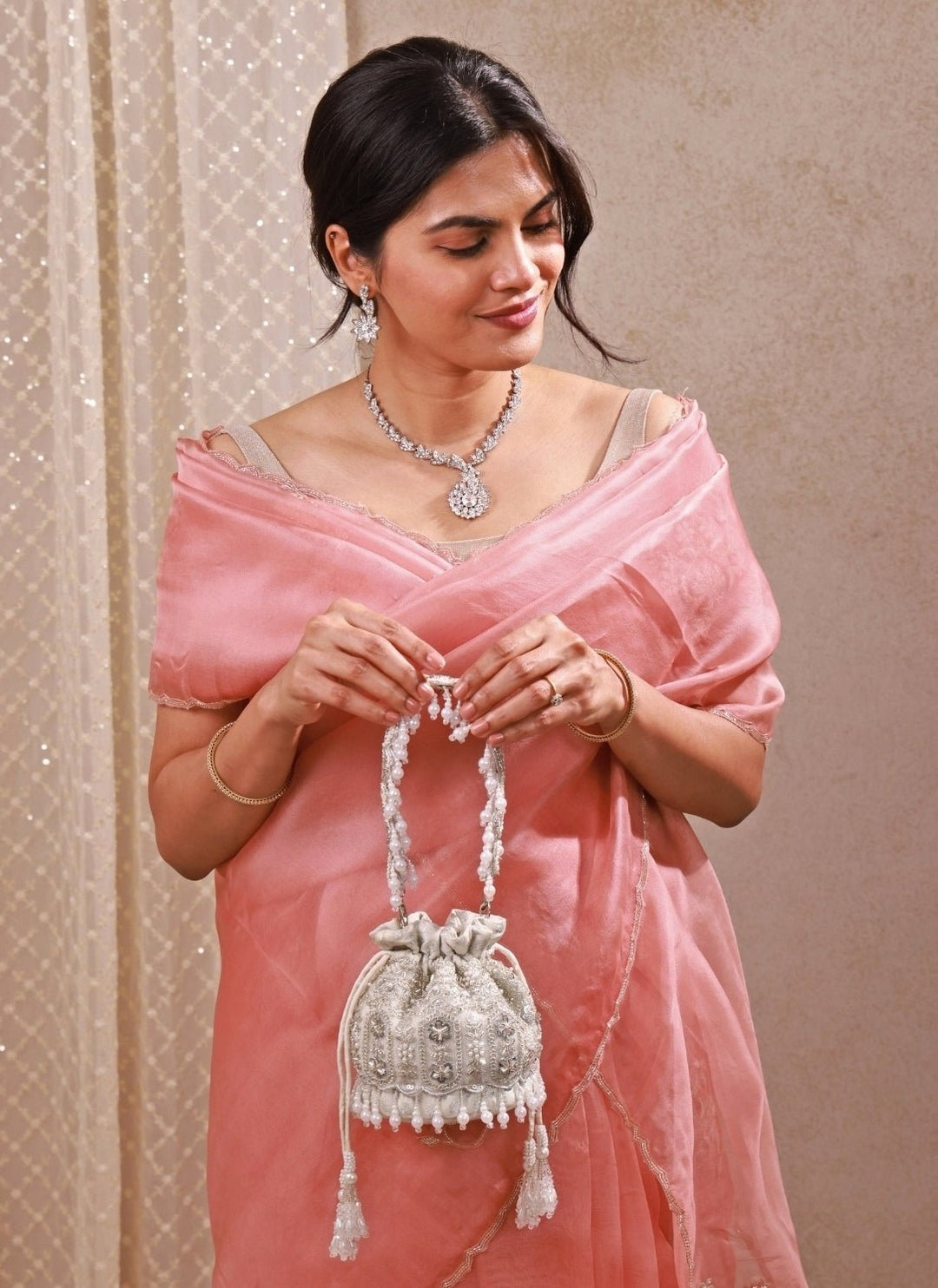 Amyra Silver Pearl Brocade Silk Mini PotliFabilicious Fashion