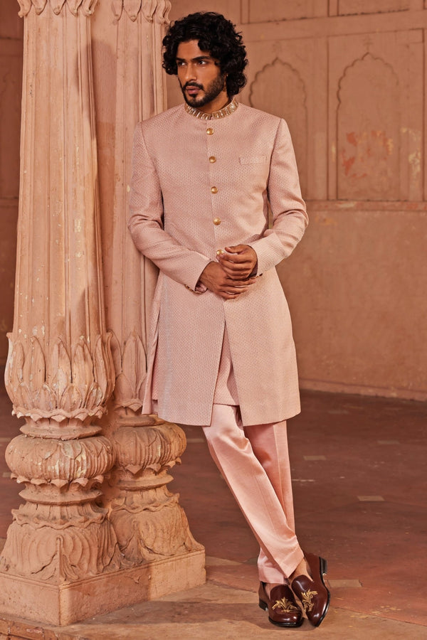 Soft pink embroidered sherwani set for the groom by Contrast by Parth
