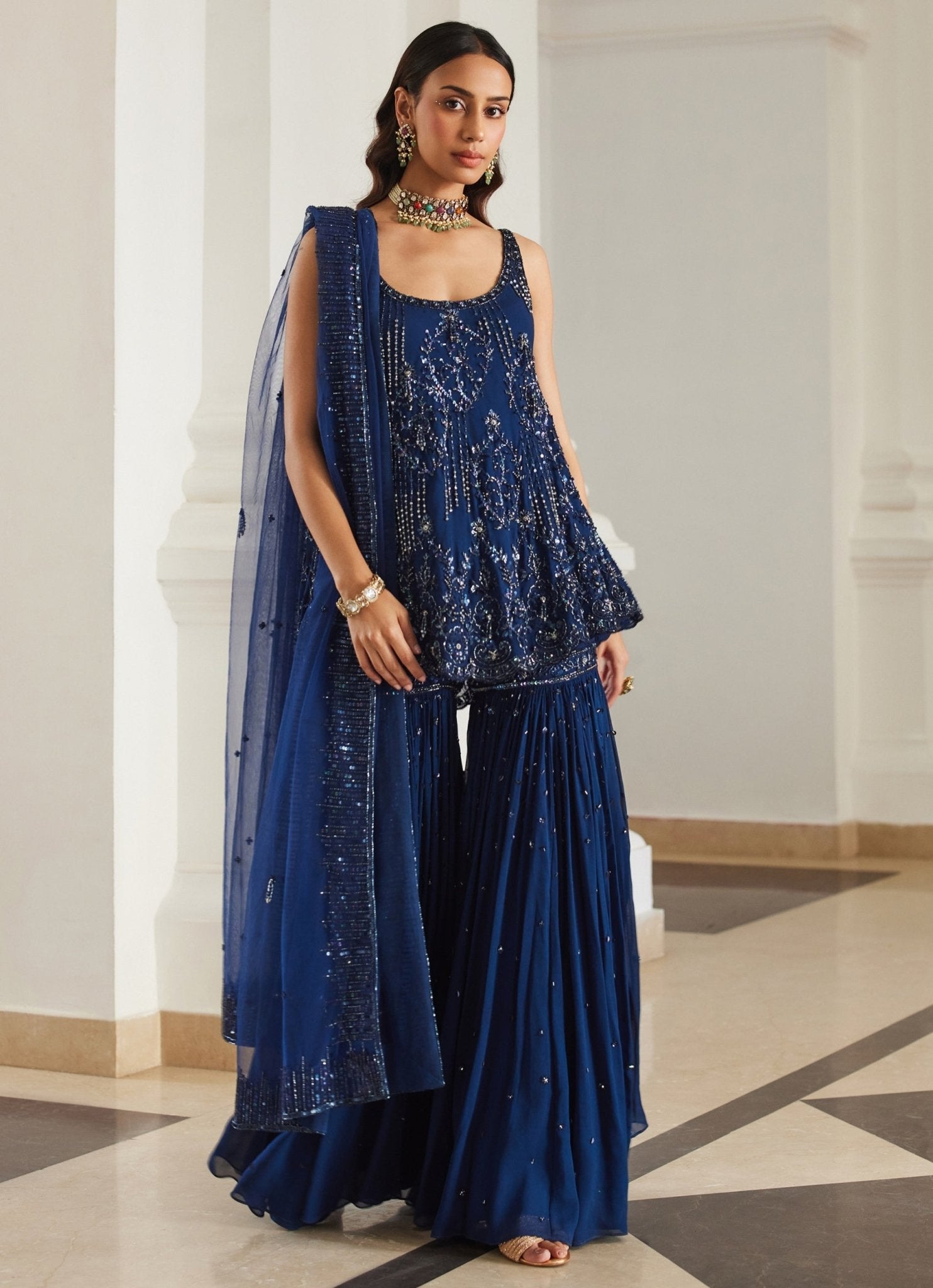 Teal blue embroidered georgette kurta sharara set by Sanya Gulati for sangeet