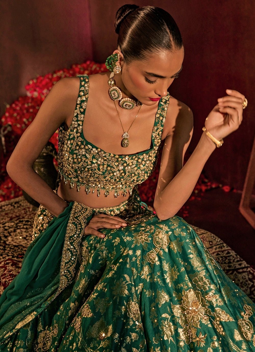 Teal green brocade silk lehenga for mehendi London by Prevasu