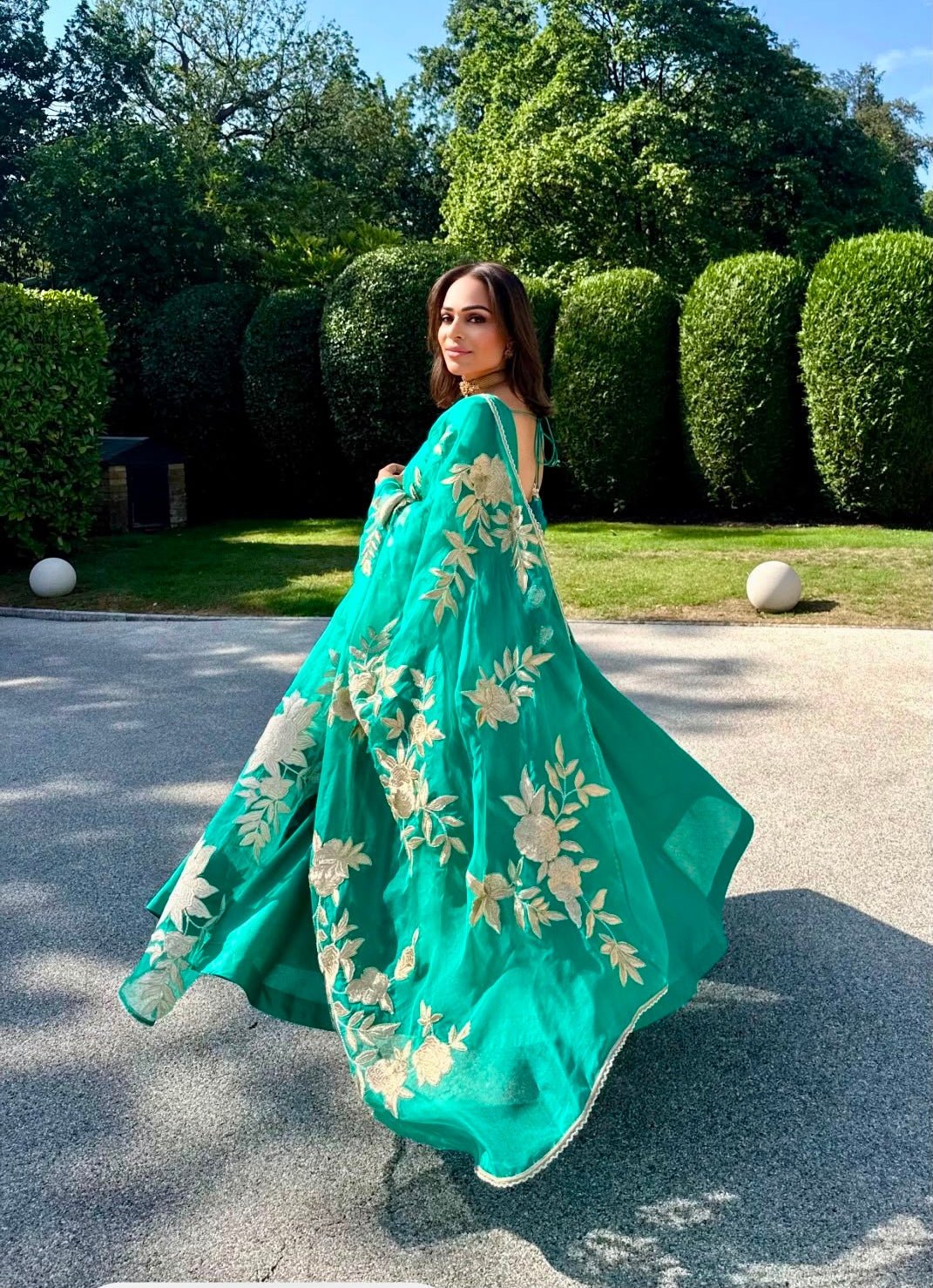 Punam wearing The Punam Gul Anarkali, a green Chanderi silk anarkali by Anisha Shetty designed specially for her