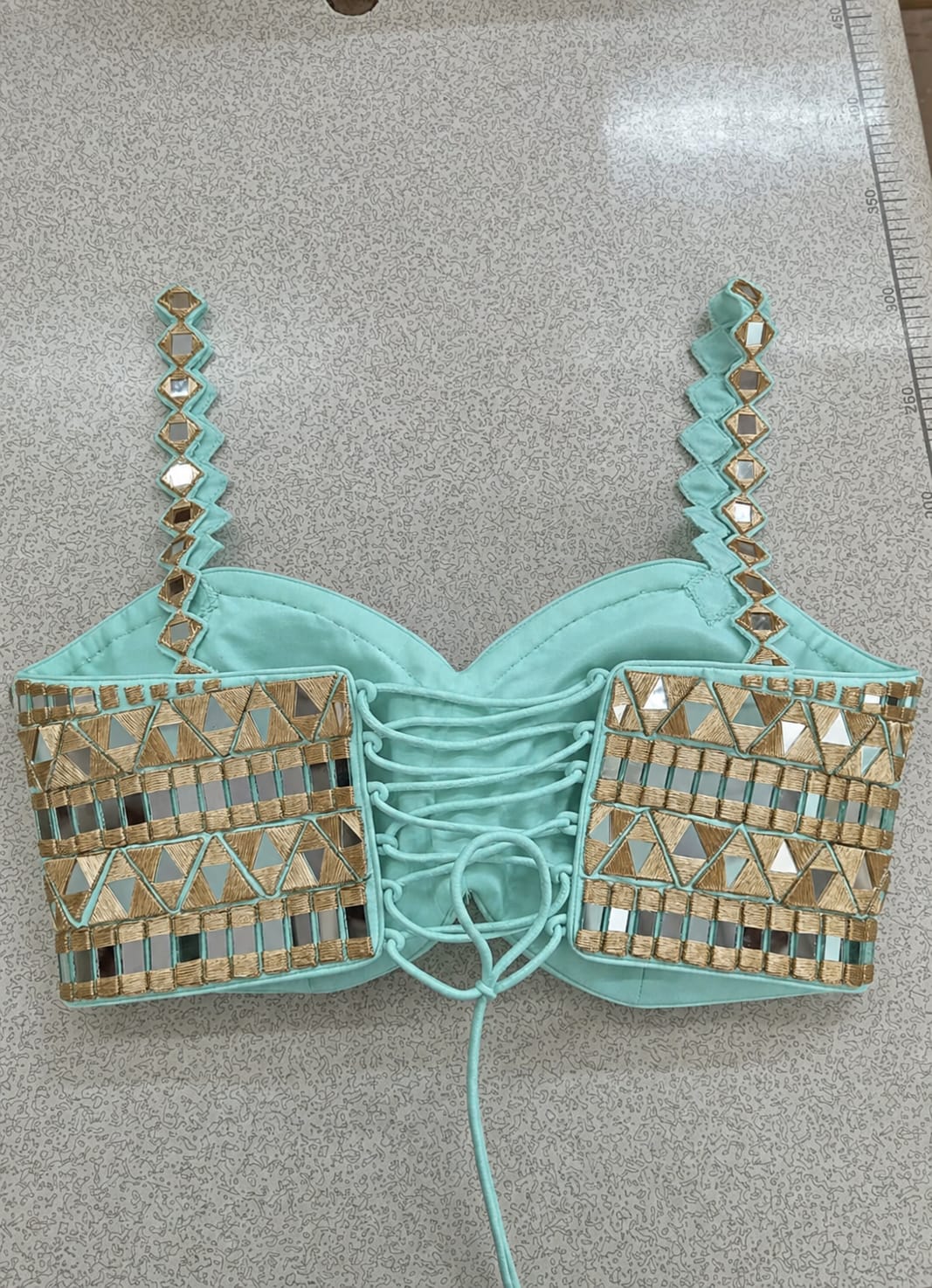 Anisha Shetty Tiffany Blue and Muted Gold Organza Lehenga with Mirror BlouseFabilicious Fashion