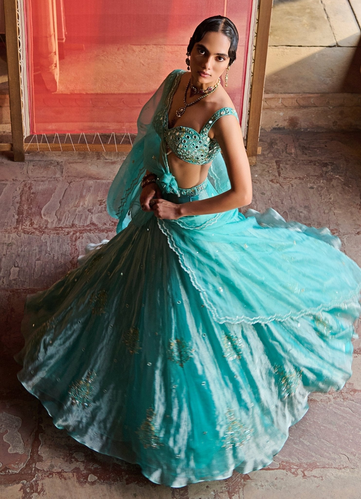 Turquoise blue embroidered tissue lehenga — sangeet night lehenga styling guide for dancing and stage-light sparkle