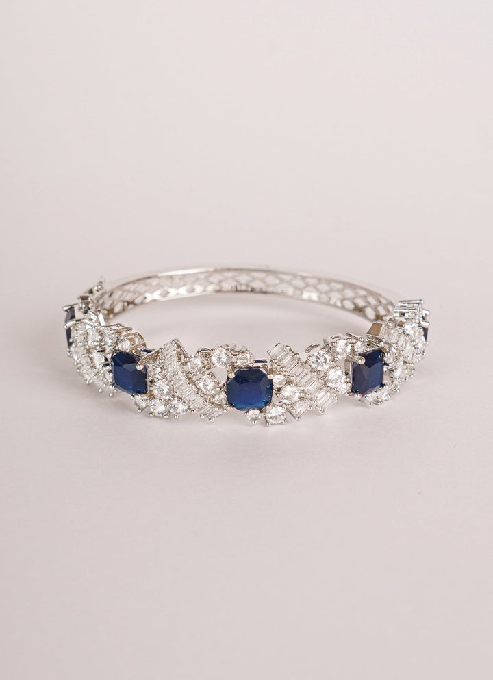 White Finish Diamond And Blue Stone Bracelet Zevar by Geeta - Fabilicious Fashion