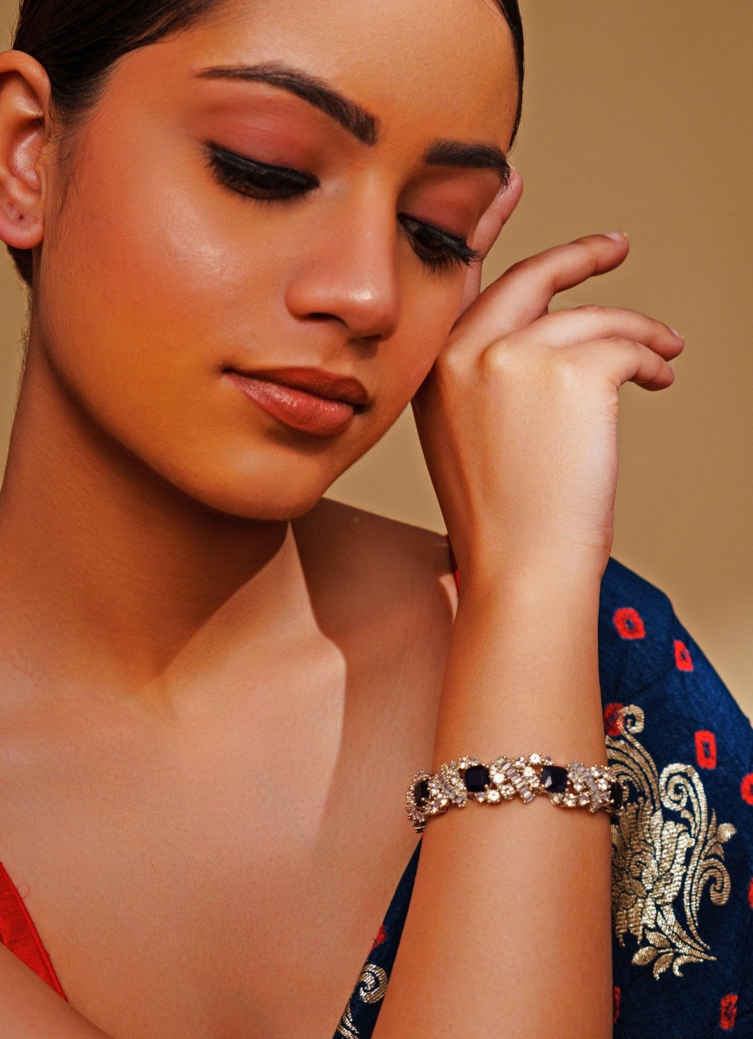 White Finish Diamond And Blue Stone Bracelet Zevar by Geeta - Fabilicious Fashion